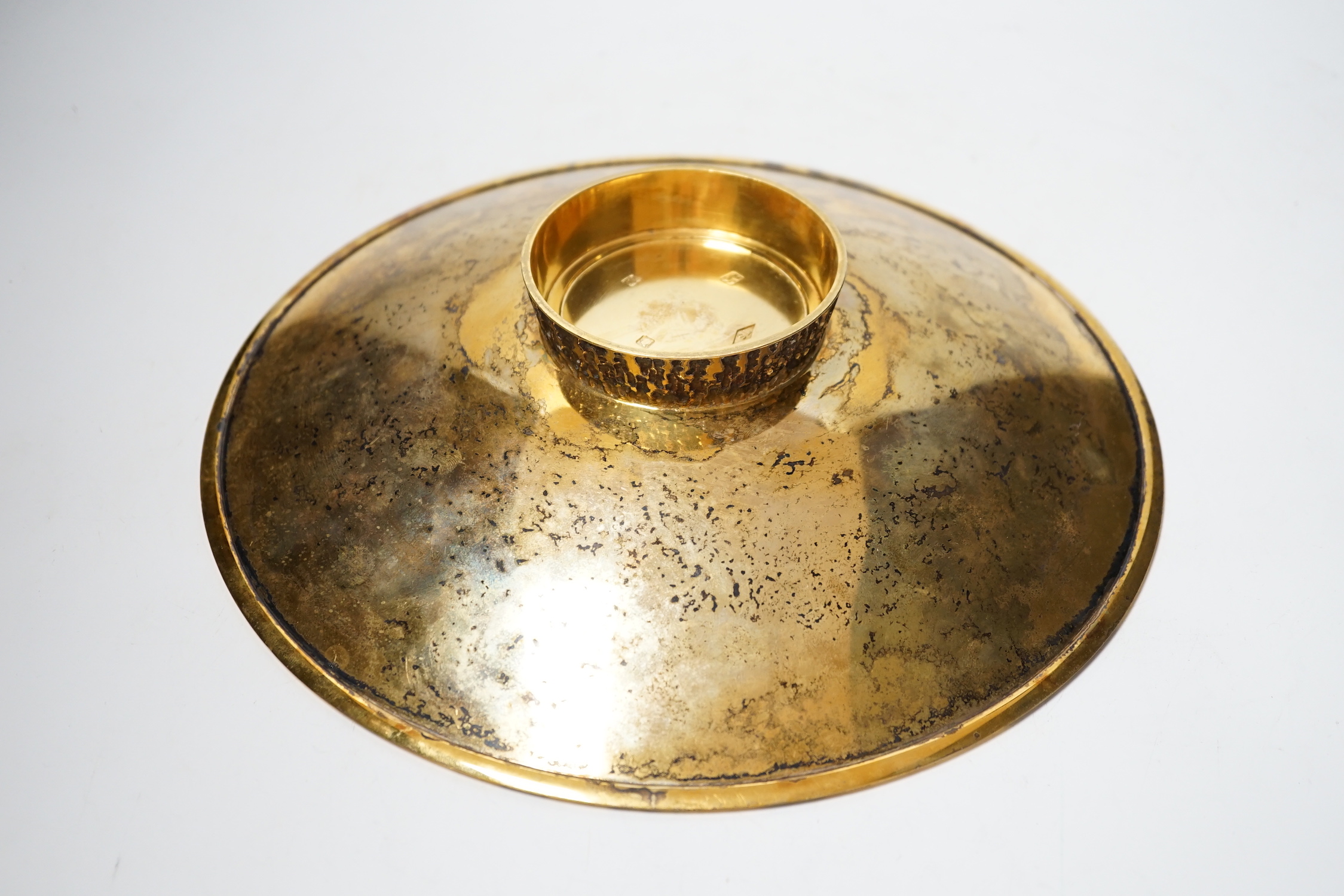 A modern planished silver gilt shallow dish, on circular foot, maker TS, London, 1996, 28.2cm, 24.4oz.